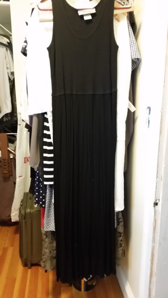Long black dress, missing its black knit cropped single-button jacket