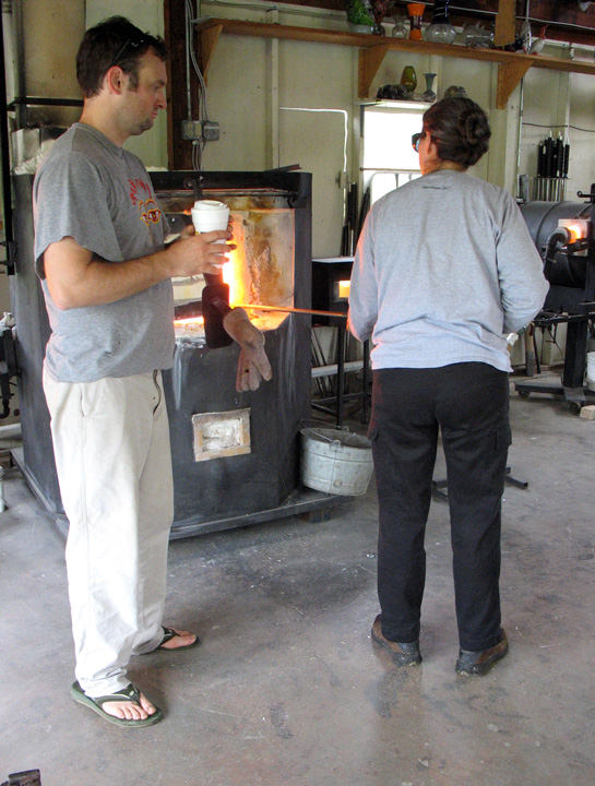 Gathering hot glass from the furnace