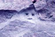 Face in stone wall.